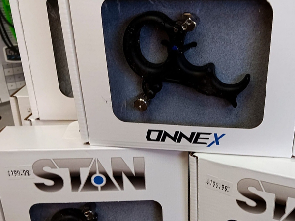 Thumb and wrist strap bow releases in Tulsa archery shop.